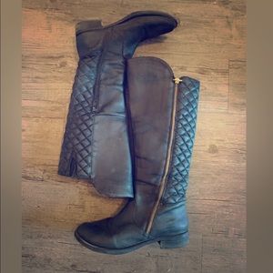 Black quilted women’s tall riding boots